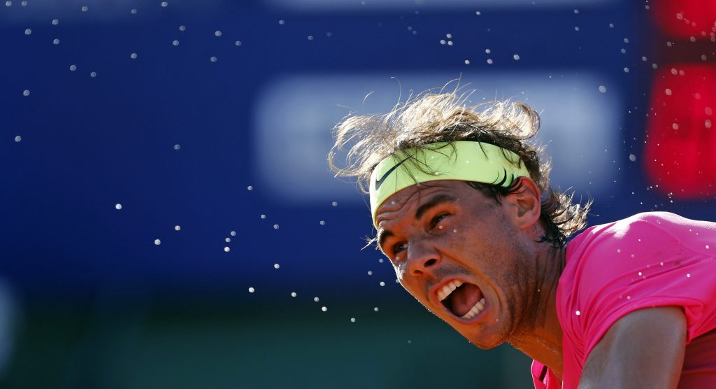 Drops of sweat come off Spain's Rafael Nadal as he serves during his tennis match against Argentina's Carlos Berlocq at the ATP Argentina Open in Buenos Aires, February 28, 2015. REUTERS/Marcos Brindicci (ARGENTINA - Tags: SPORT TENNIS)